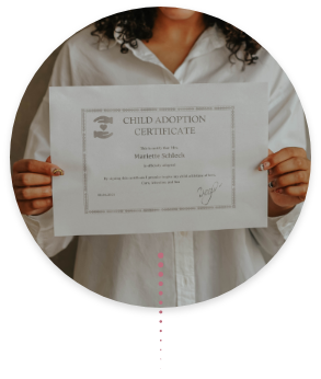 woman holding a child adoption certificate